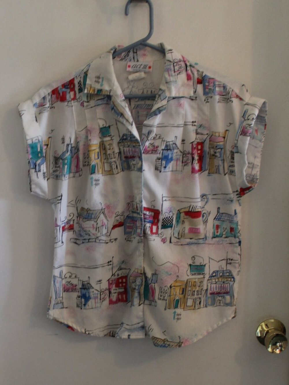 Short-sleeve, button-down camp-collar blouse, colorful, cityscape print